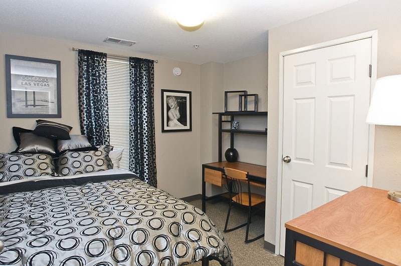 Model bedroom with a desk at CP Cincy